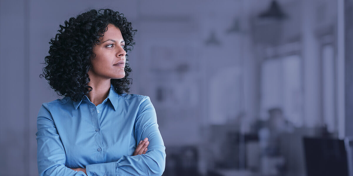 woman looking thoughtful in an office