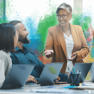 woman smiling at her team during a presentation