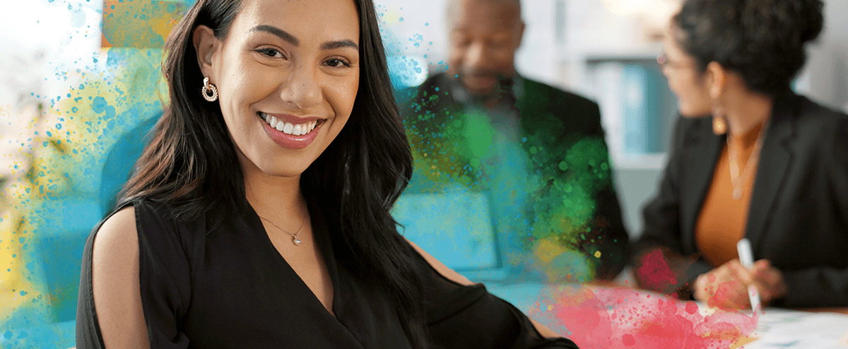 photo of a woman smiling with people in the background