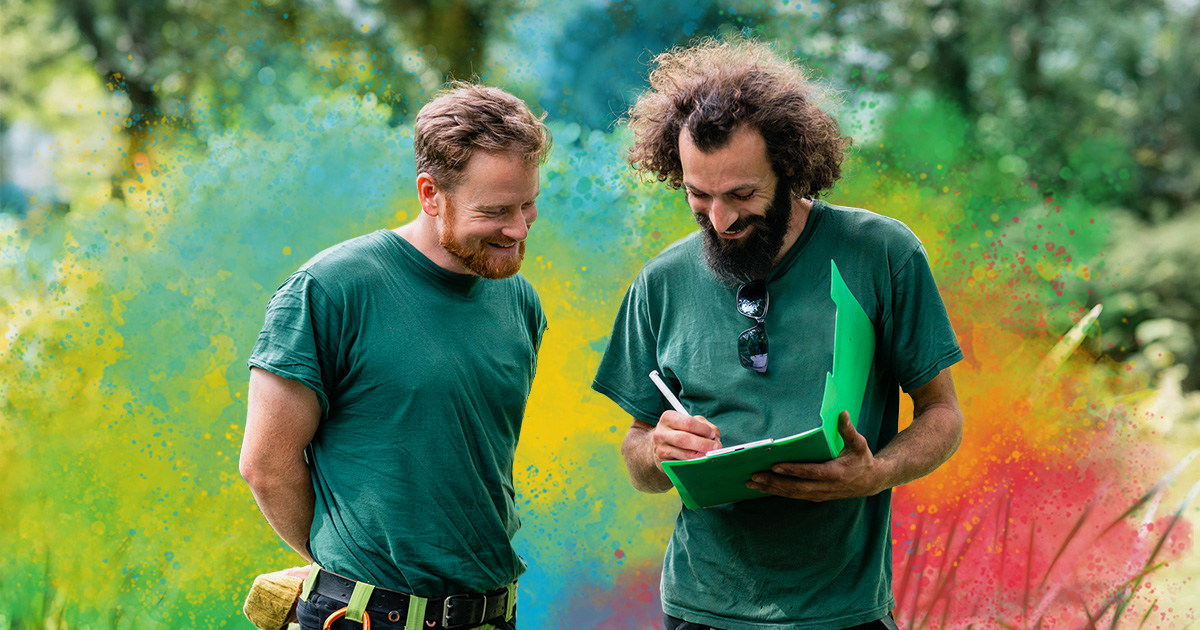 Two landscapers in discussion, engaged employees