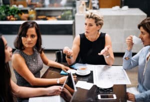 Group of coworkers having animated discussion