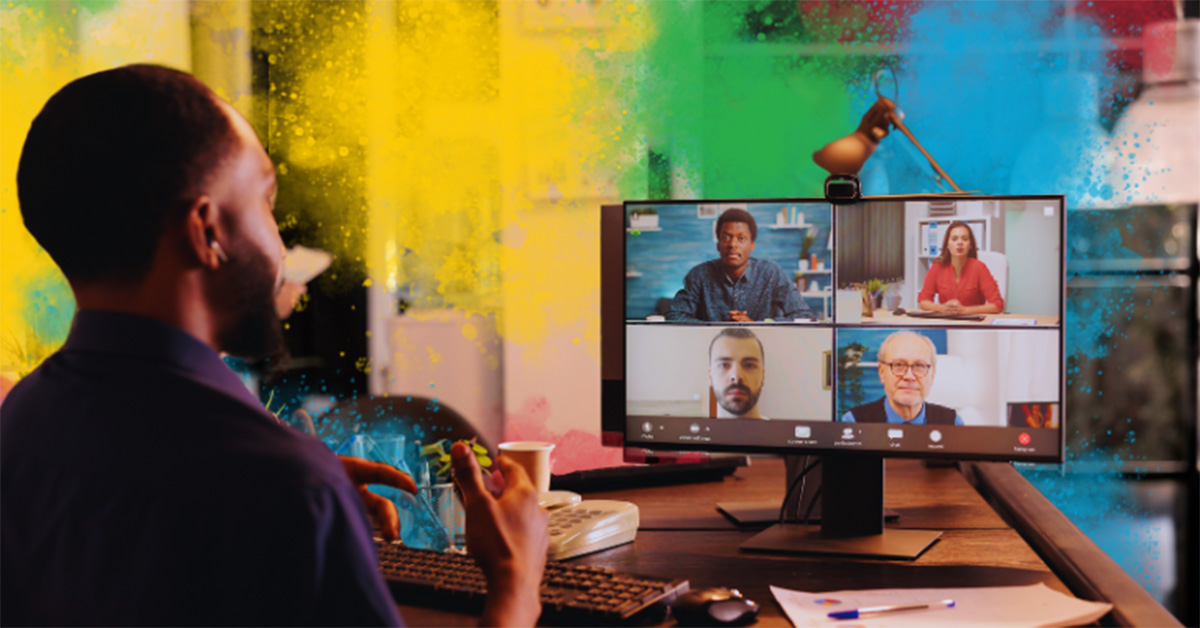 Image of an individual managing his remote team, talking to them on a video call