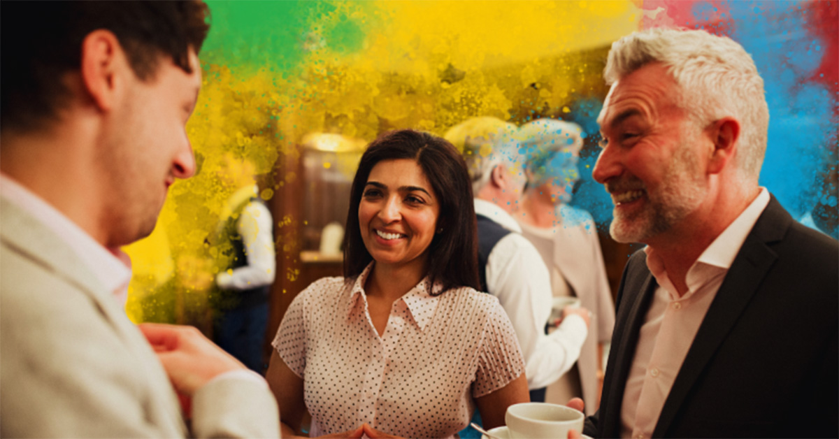 Image of three people with different DiSC styles interacting at a sales event with a colorful DiSC background