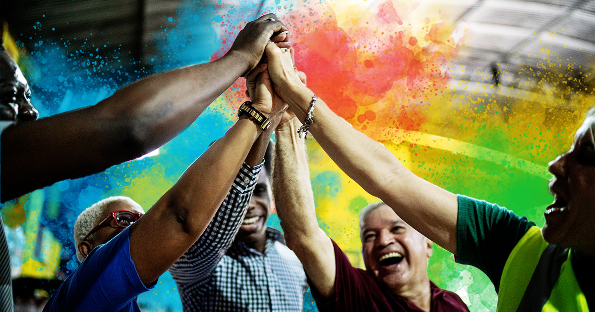 Commitment on a team photo of five people with their hands together for a break