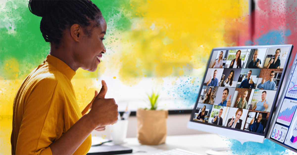 Image of a manager showing appreciation for her team and giving them a thumbs up on a video call