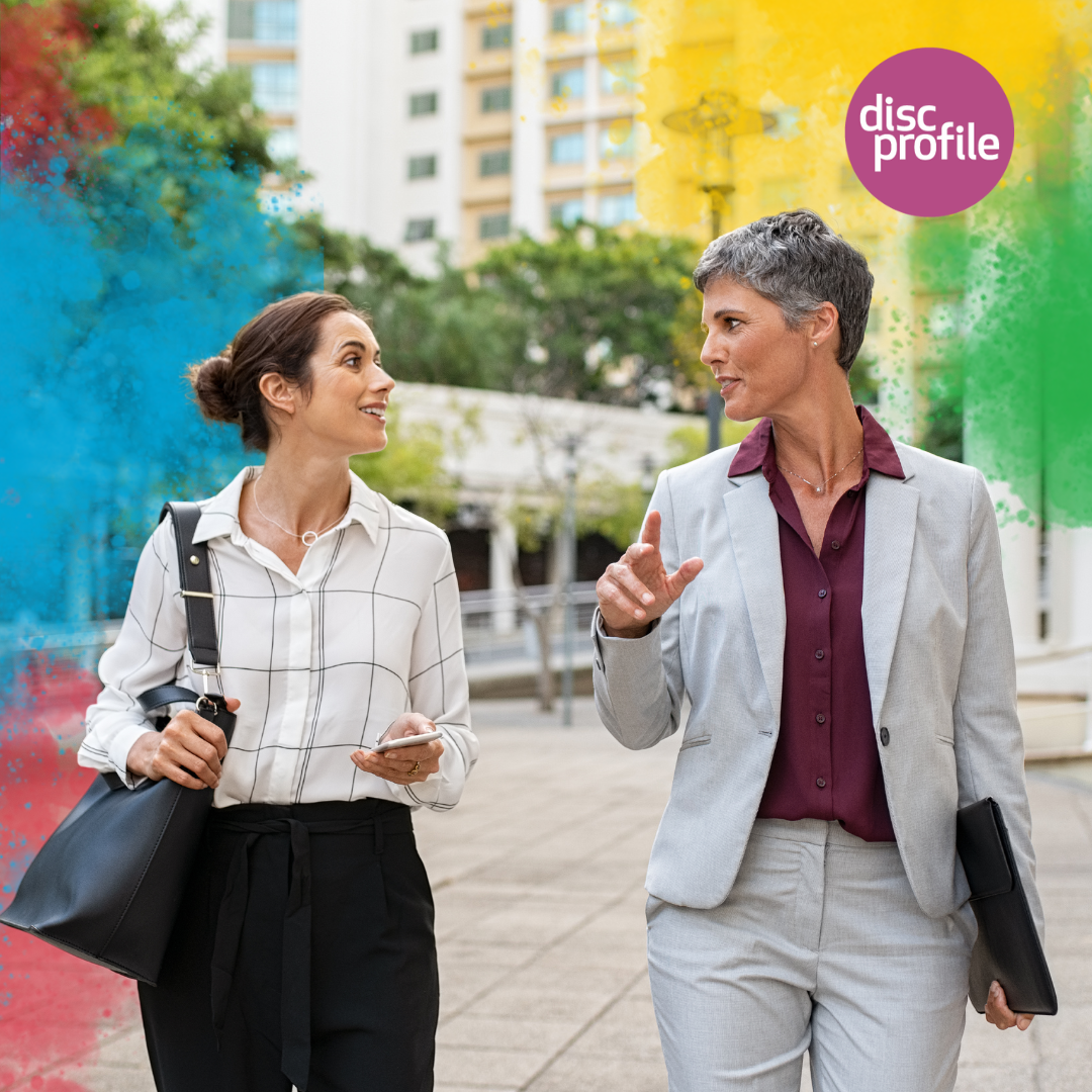 women taking a meeting outside walking